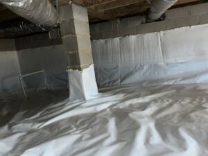 Basement with white vapor barrier installation